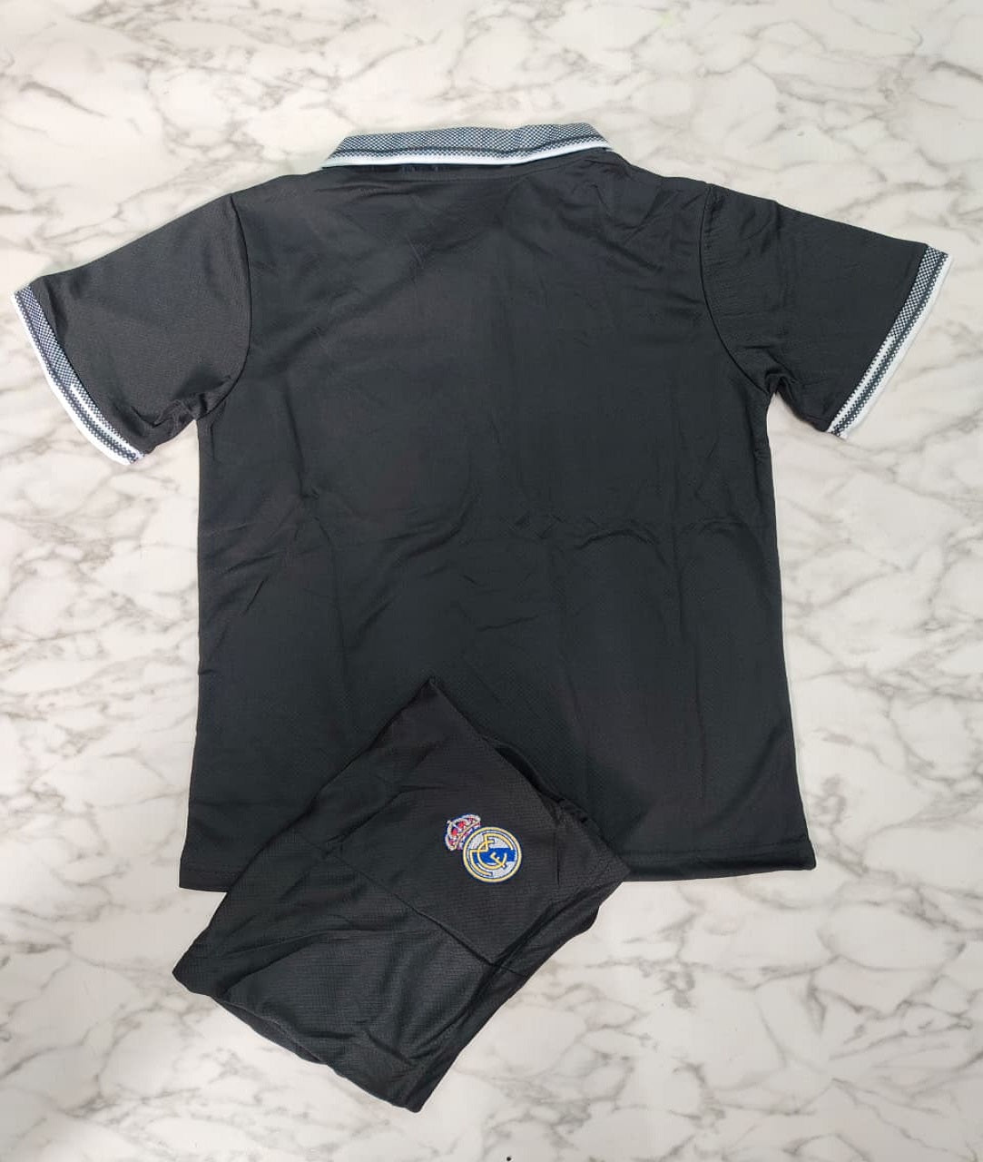 Real Madrid Polo Black 26/27 Imported Kids Football Jersey Set (Jersey + Shorts)